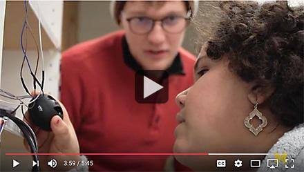 India West and student testing voice recognition device.