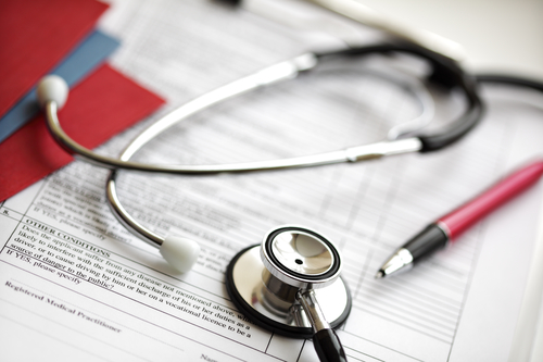 Medical records and stethoscope