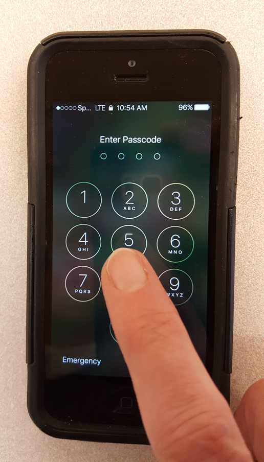 Photo of hand punching in a passcode on a smartphone
