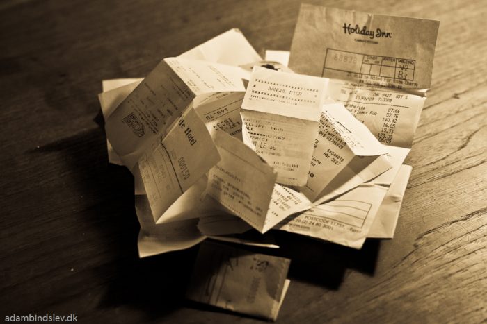 BW photo of pile of receipts and bills.
