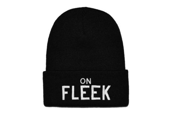 black knit cap with "on fleek" in white letters