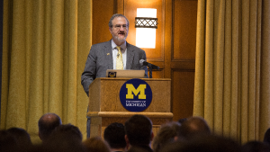 photo of President Schlissel standing at podium.