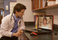 Male doctor interacting with virtual patient.