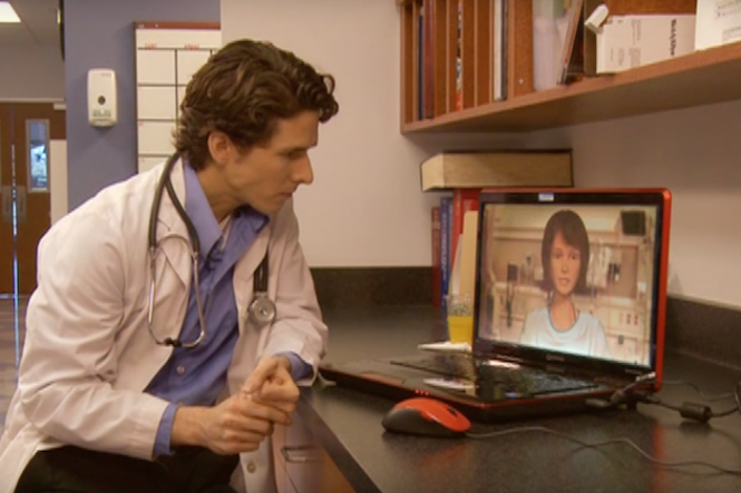 Male doctor interacting with virtual patient.