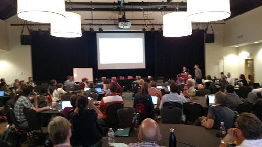 presenter with room of attendees