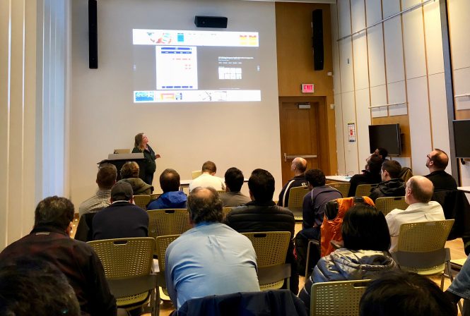 presenter showing slides at mobile dev meeting