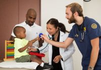 Asian female doctor, white male nures with African American man and his son
