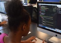 african american girl coding on computer