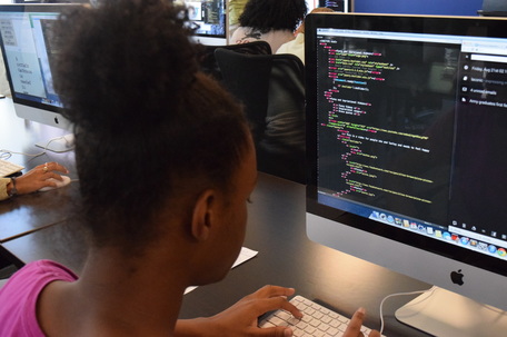 african american girl coding on computer