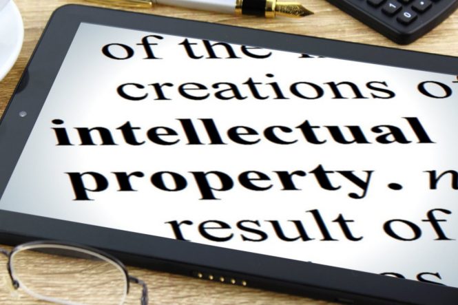 ipad with the words "intellectual property" on the screen