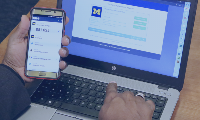 A person uses the Duo Mobile App to authenticate with U-M Weblogin