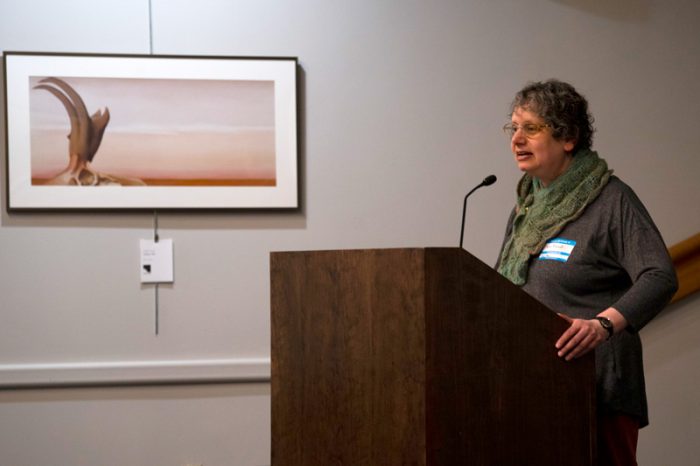 Jane Berliss-Vincent speaks at the podium at World IA Day 2019 in Ann Arbor