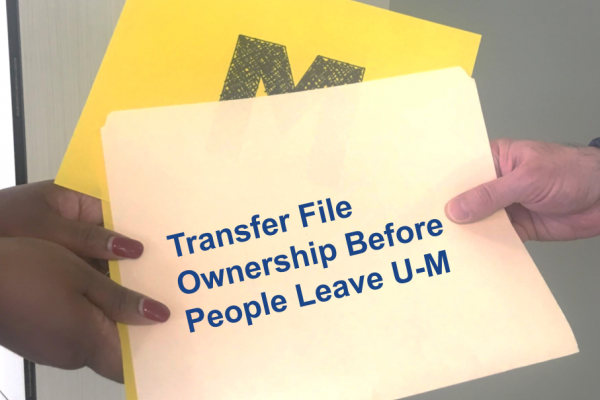 file being handed between two peopls
