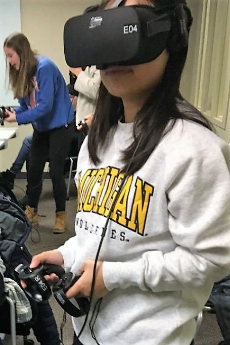 young woman wearing VR goggles