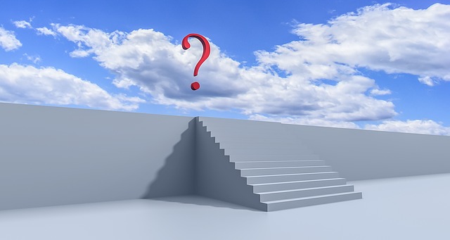 stairs with a floating question mark in a blue sky with clouds