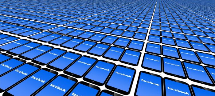 hundreds of phones showing facebook logo on screens