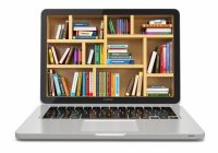 laptop with images of books on the screen