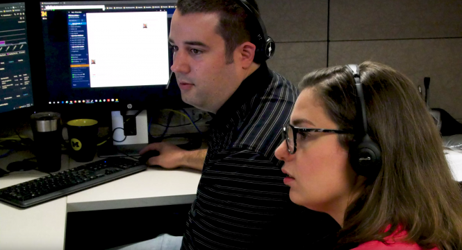 An ITS staff member shadows a Service Center associate during a RideAlong session.