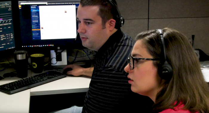 An ITS staff member shadows a Service Center associate during a RideAlong session. 