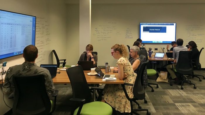 Two teams from Scholar Sprints Summer 2018 working in ScholarSpace (206 Hatcher Graduate Library)