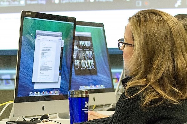 Woman sitting at computer.