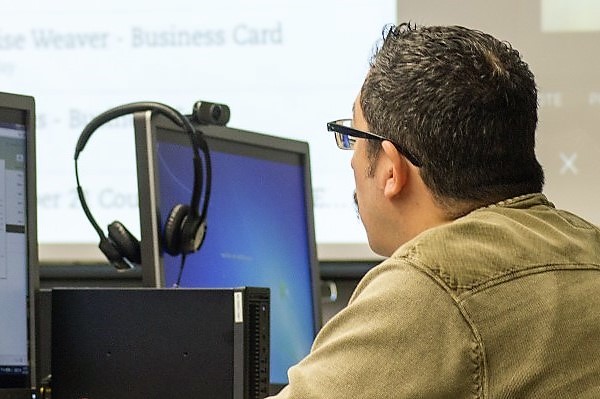 Man sitting at computer.