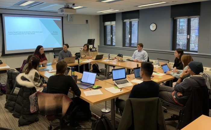 diverse group of college students in a classroom seminar setting