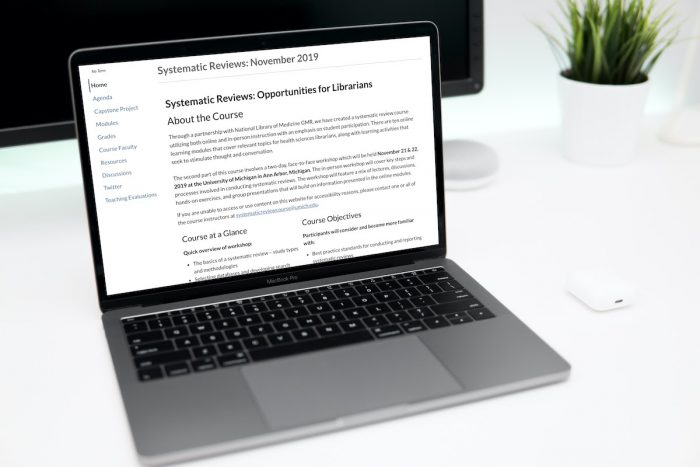 laptop with screen shot of systemic review course page