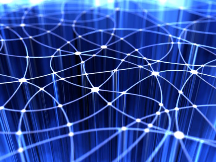 stylized image of a network, web of white points of light on a dark blue BG