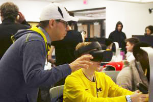 Instructor helping student using VR technology