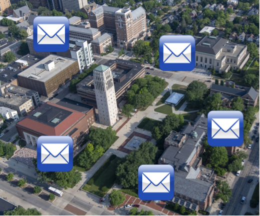 mail icons floating over aerial photo of central campus