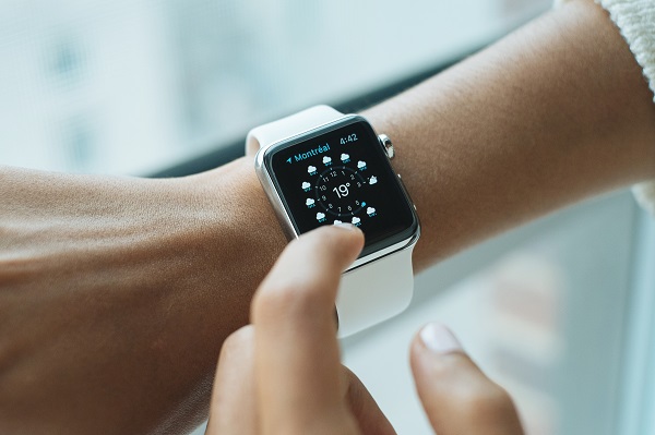 womans hand showing smartwatch