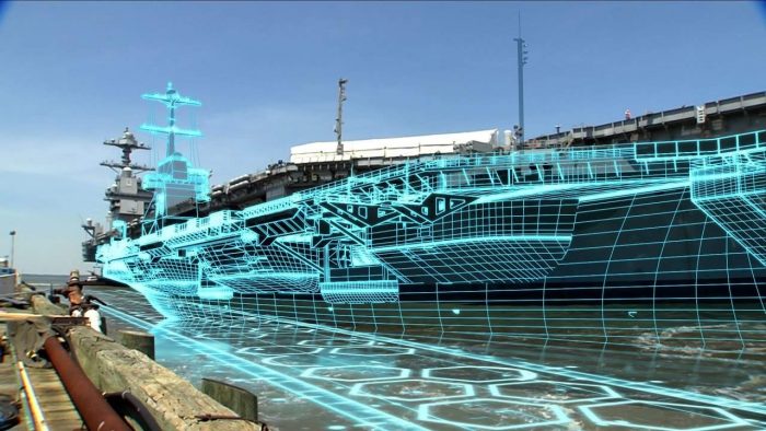 A computer model of a naval ship overlaid an actual naval ship. 