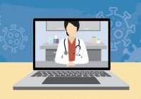 female physician on laptop screen