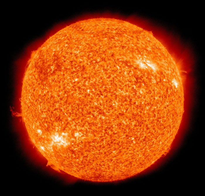 (Close-up image of the sun wit bright spots in the bottom left and top right.)
