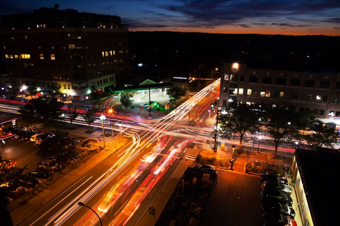Aerial nighttime timelapse view of traffic in Ann Arbor downtown intersection.