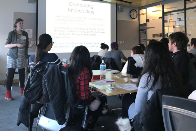 Women instructing class, on screen: Combating Implicit Bias