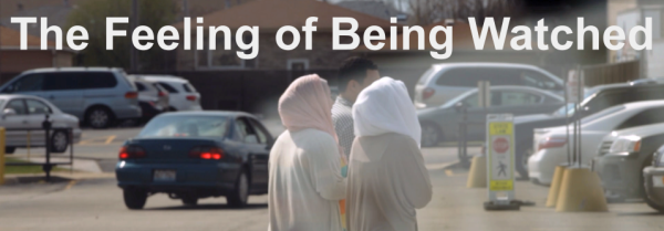 The Feeling of Being Watched - Two women wearing headscarves seen from behind walking across a parking lot.
