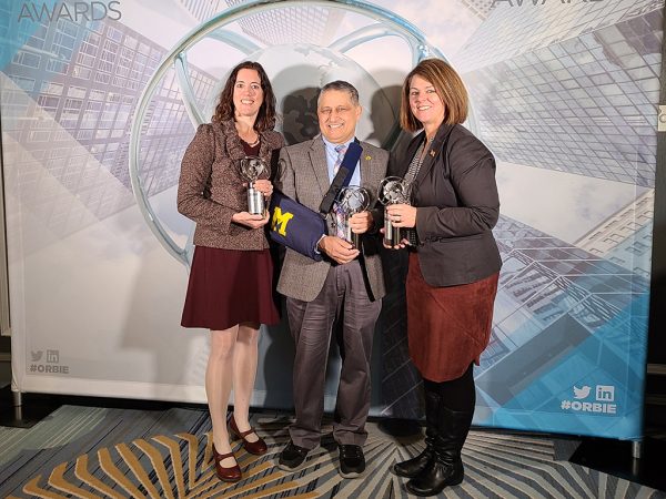 Pictured from left to right: Carrie Shumaker, Ravi Pendse, and Cathy Curley pose for a photo with their ORBIE awards.