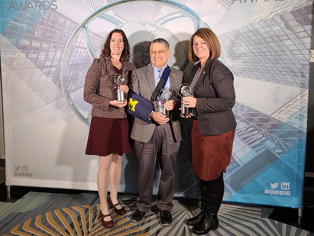 Pictured from left to right: Carrie Shumaker, Ravi Pendse, and Cathy Curley pose for a photo with their ORBIE awards.