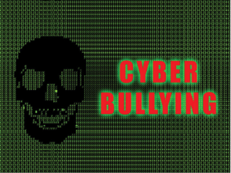 Black skull and the words cyber bullying against a black and green background.