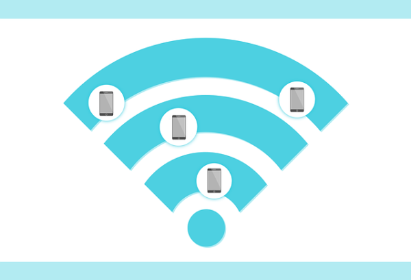 A WiFi symbol with images of 4 cell phones over laid.