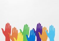 rainbow hands being raised against a gray background