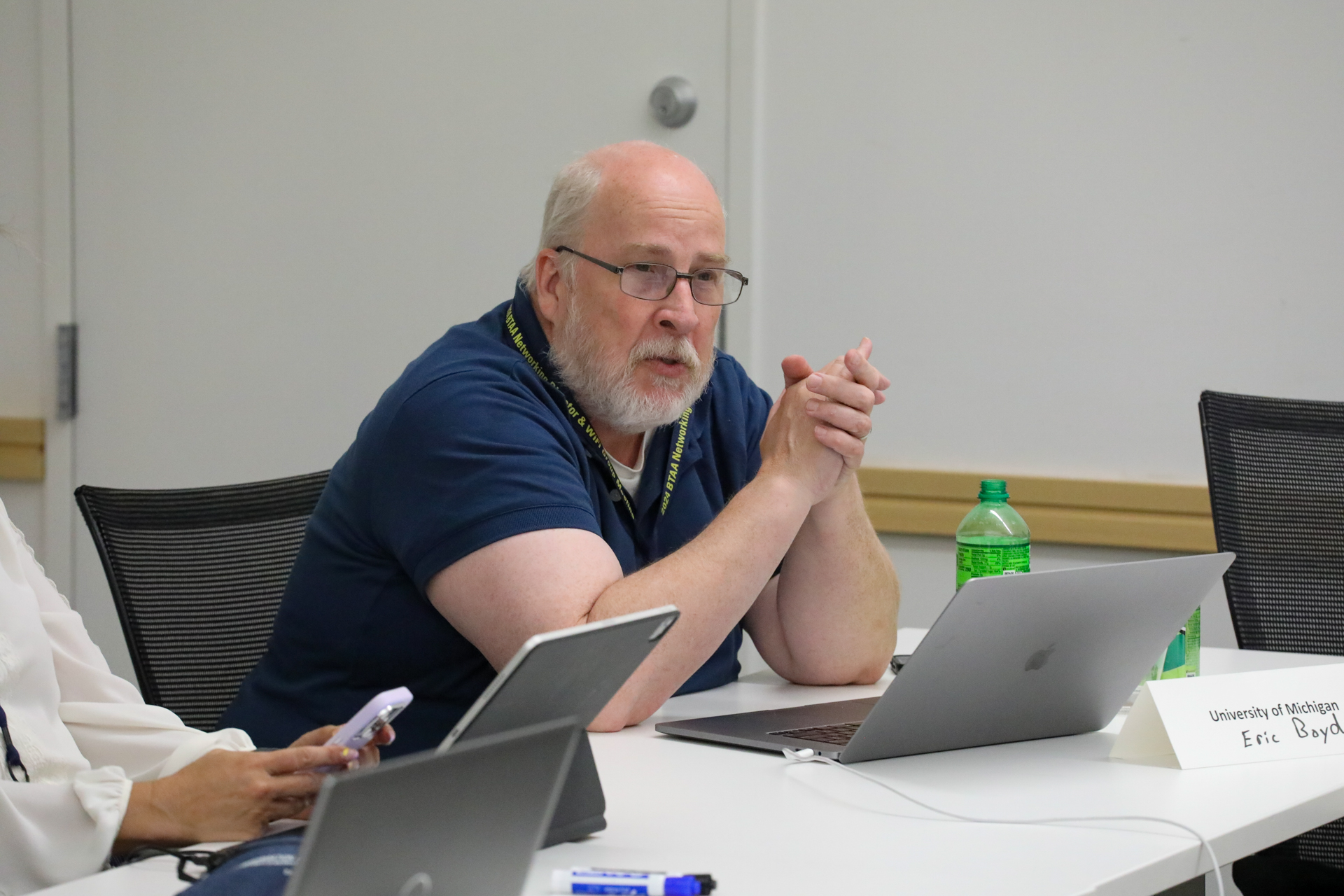 Eric Boyd, director of networks for ITS, provides an update on current network projects at U-M while sitting at a desk with his laptop.
