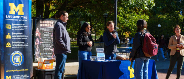 IA staff on the Diag talking with students about safe computing