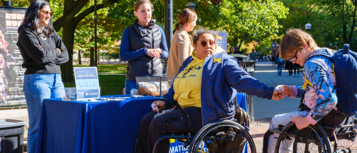 Students stop by the IA table on the Diag