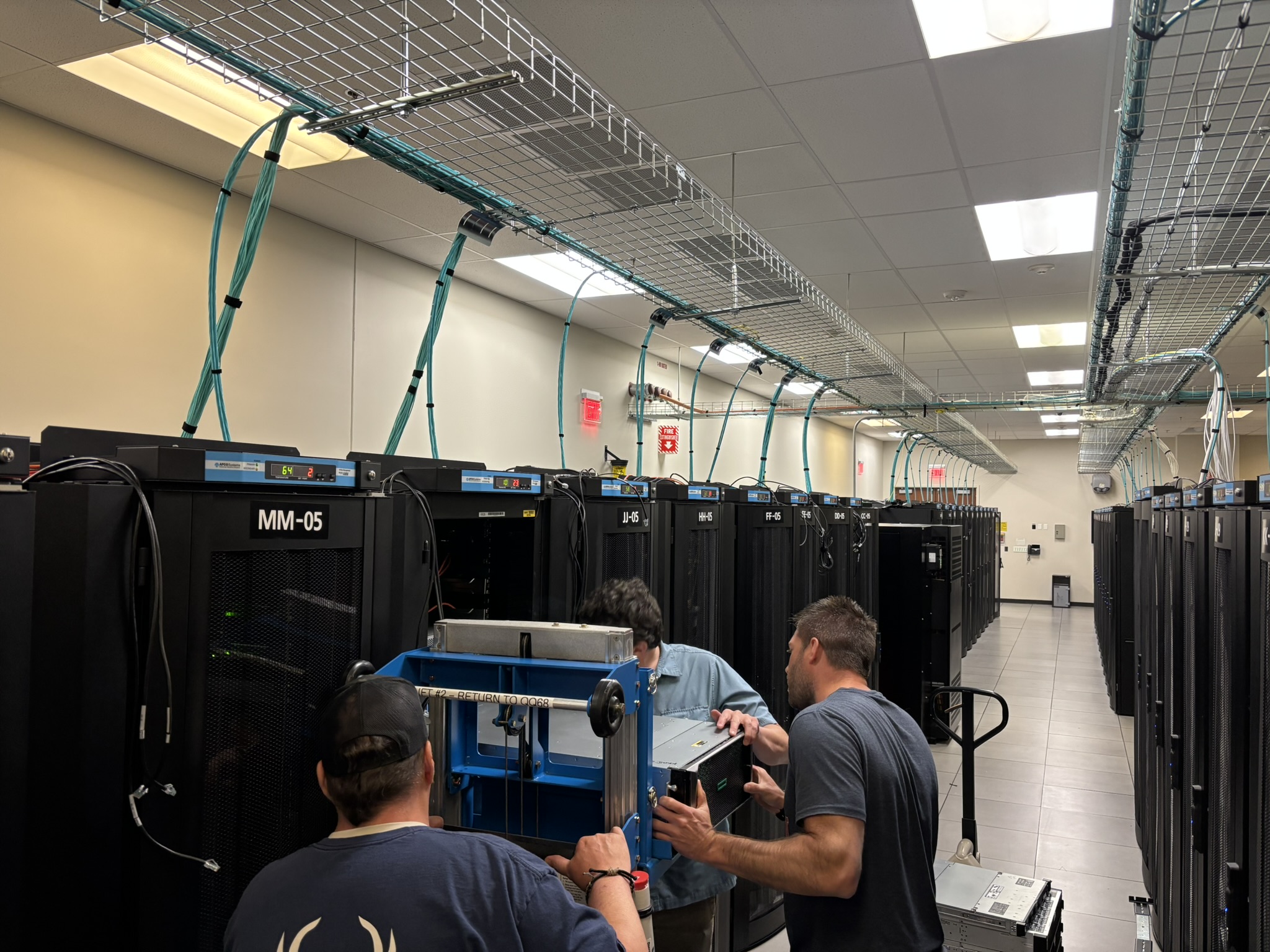 Staff moving hospital servers to the North Campus Data Center in Ann Arbor.