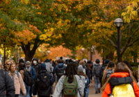 Michigan students walking through the Diag among fall colors