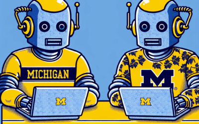 Two robots in yellow helmets and Michigan-themed shirts work at laptops with the University of Michigan logo on a blue and yellow background.