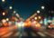 Blurry city street at night